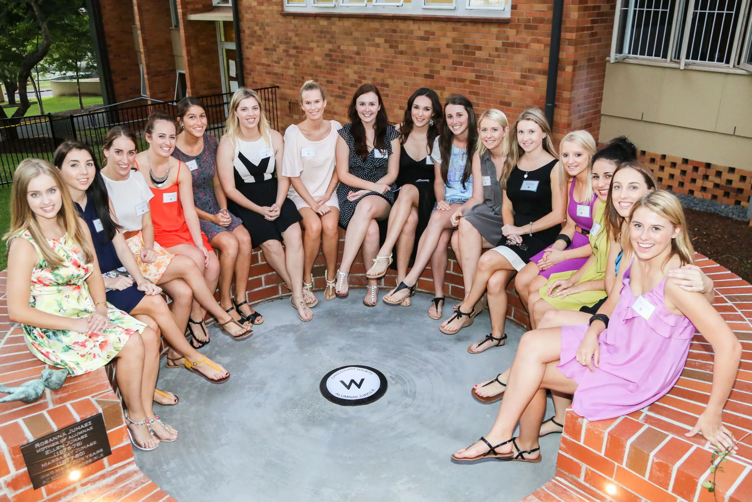 A group of young women seated in a circle.